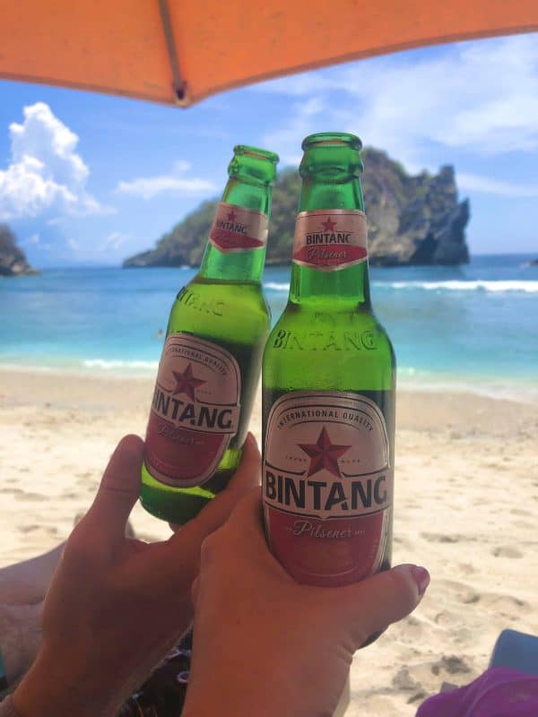 Enjoying a cold beer on Atuh Beach, Nusa Penida Indonesia.