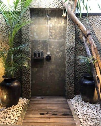 Outdoor shower in room of Batu Karang Villa