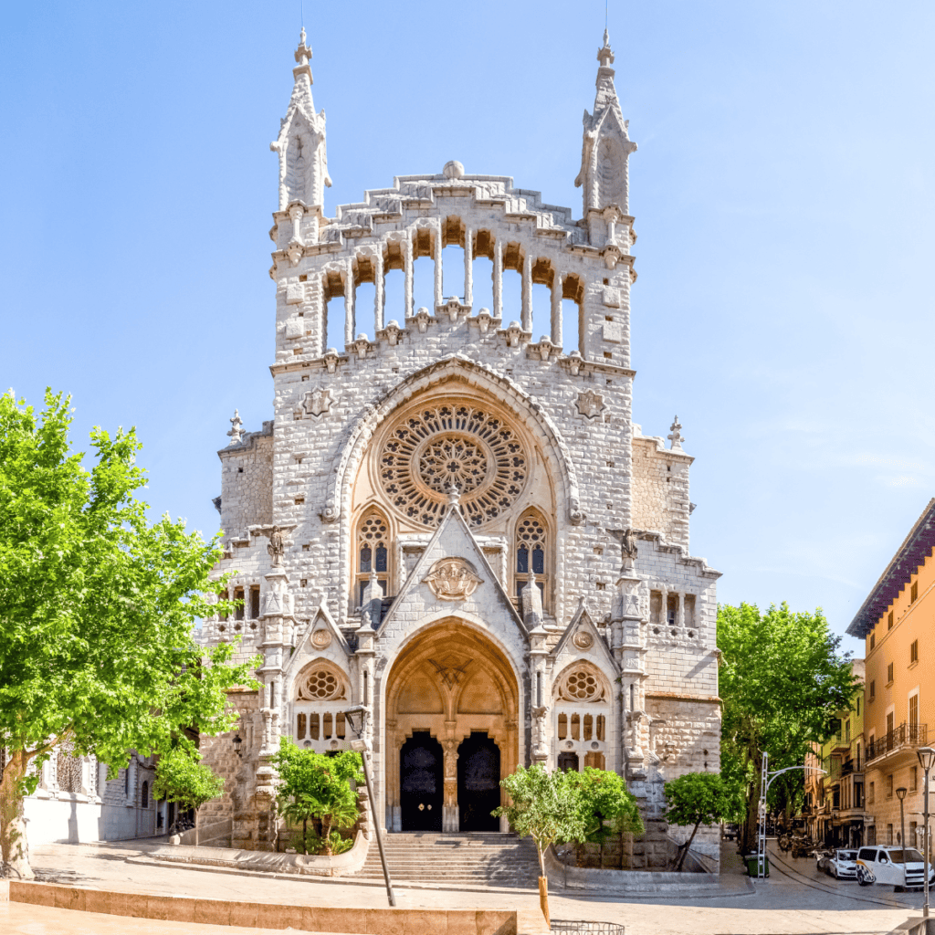 One of the best places to visit on your road trip Mallorca- the parish church of Saint Bartholomew in Soller.