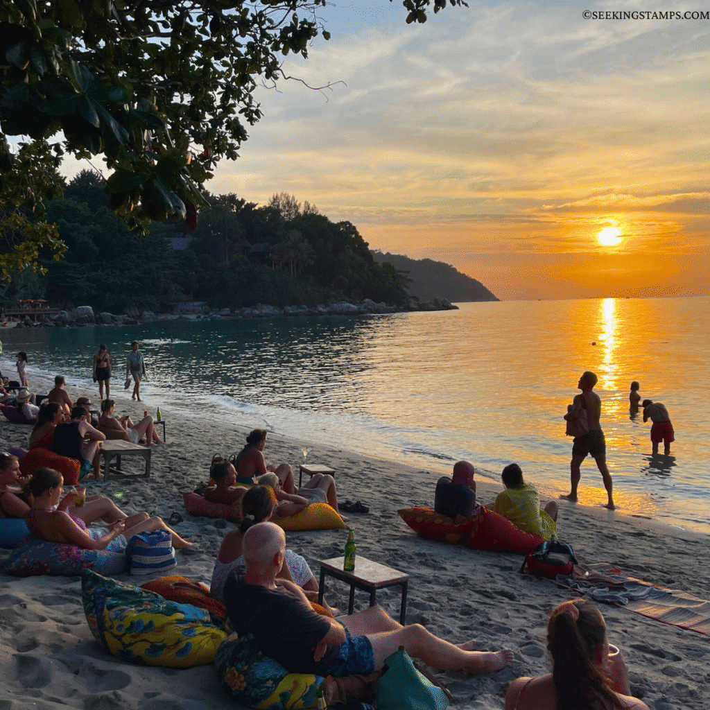 Tourists admiring the view at Sunset Beach Koh Lipe.
